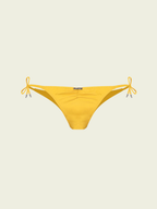 Yellow bikini bottom with bow details on a beige background