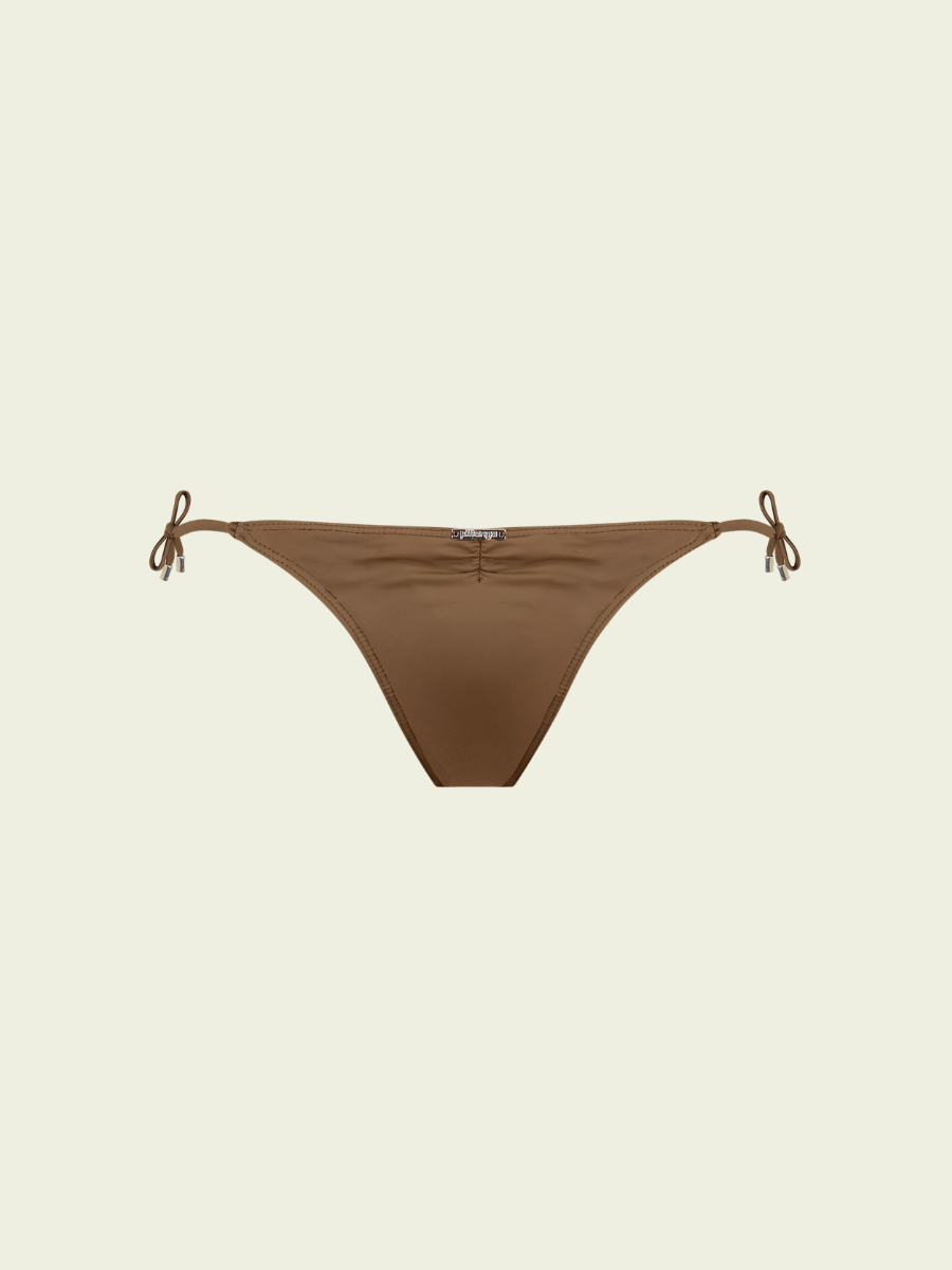Brown bikini bottom with string ties on a beige background