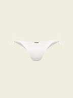 White bikini bottom on a light beige background