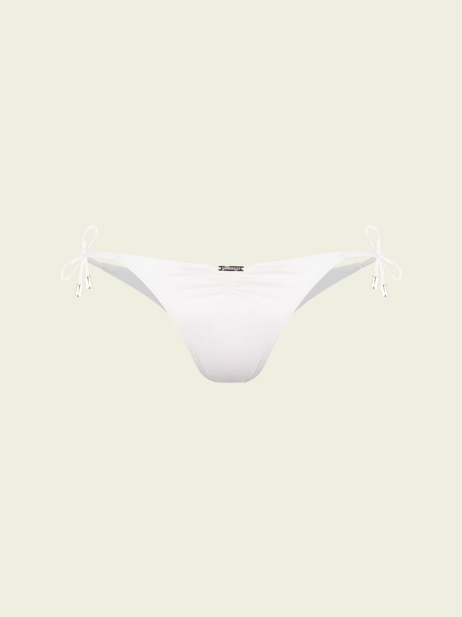White bikini bottom on a light beige background