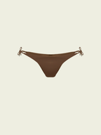 Brown bikini bottom with string ties on a beige background