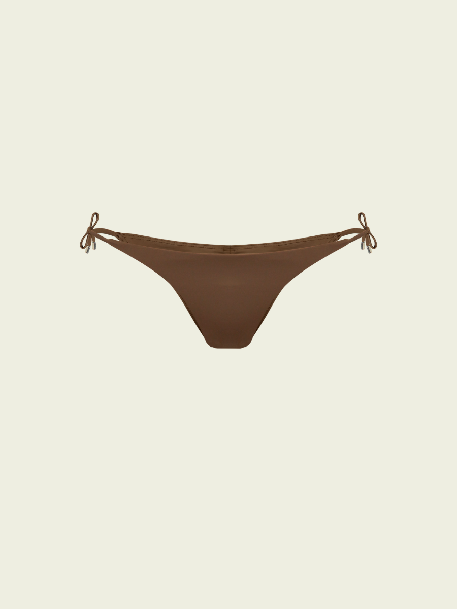 Brown bikini bottom with string ties on a beige background