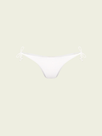 White bikini bottom on a light beige background