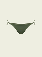 Green bikini bottom with tie sides on a beige background
