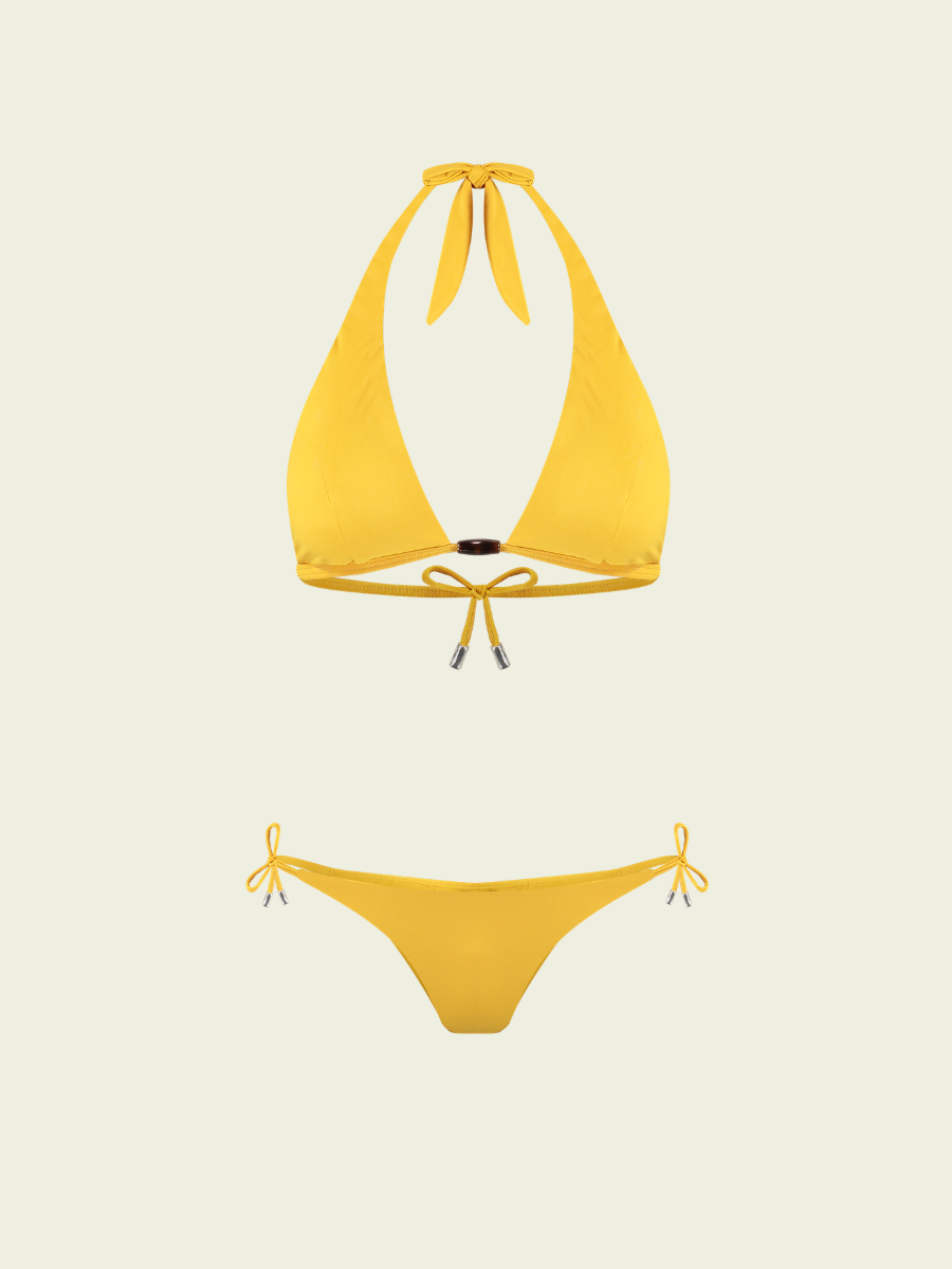 Yellow bikini set on a light beige background