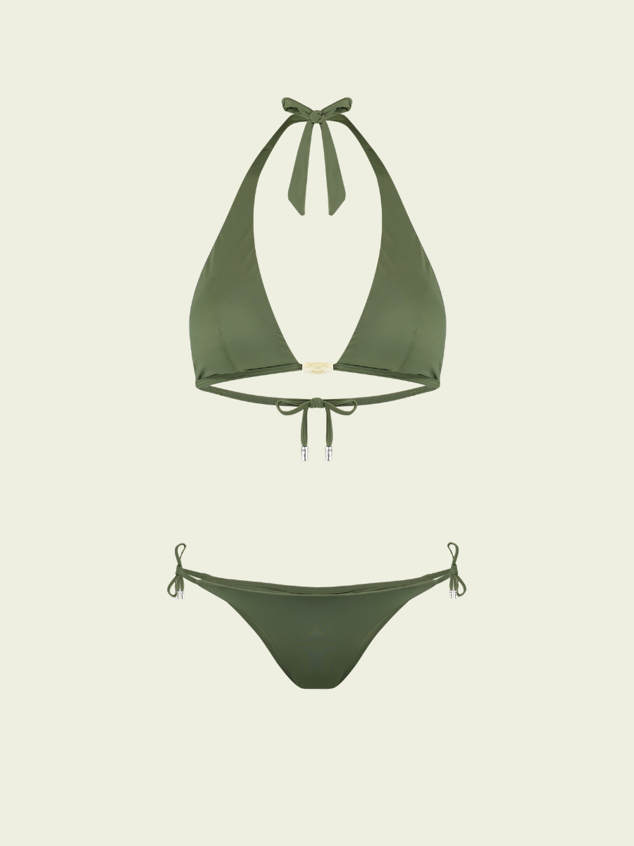Green bikini set on a light beige background
