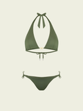 Green bikini set on a light beige background