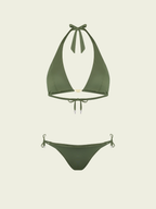Green bikini set on a light beige background