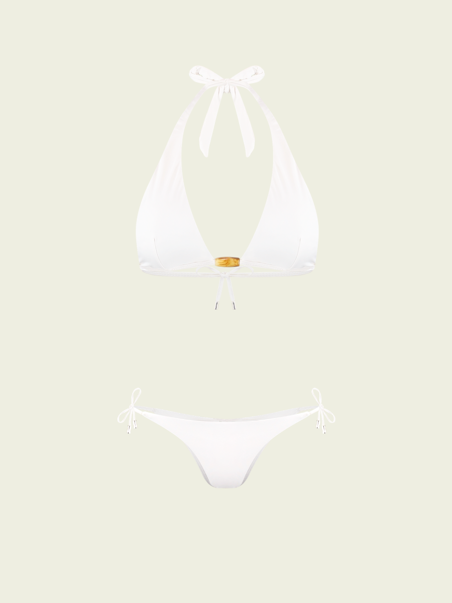 White bikini set on a light beige background