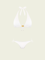 White bikini set on a light beige background