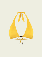 Yellow bikini top on a beige background