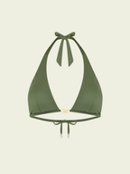 Green bikini top on a beige background