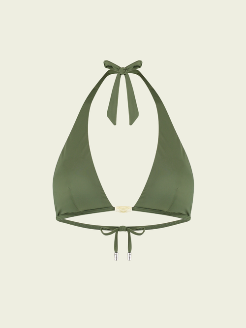 Green bikini top on a beige background
