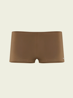 Brown swim briefs on a beige background
